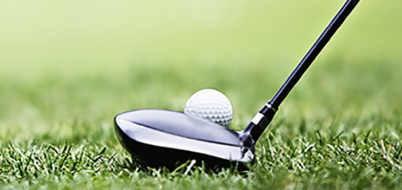 stock image of golf ball and club